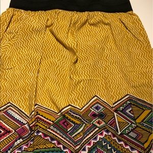 Yellow skirt with multi colored design on bottom